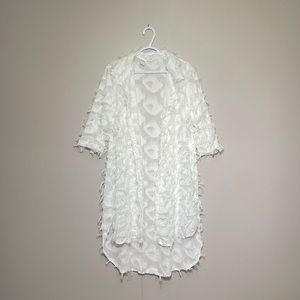 Custom feathered cardigan.